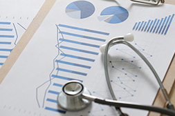 Stethoscope and pie charts and graphs