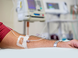 close up view of a mans arm while having an IV immunoglobulin infusion at hospital