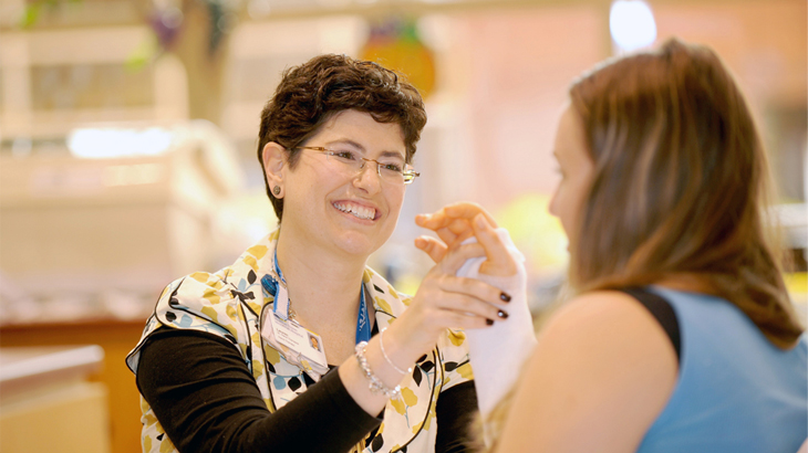 health professional checking patient’s hand