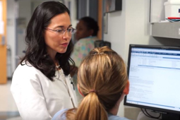 Physicians working on computer