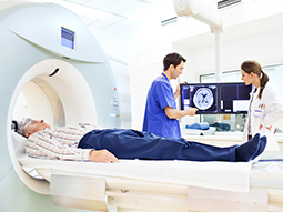 Radiologist and medical technician at the computer tomography getting a scan